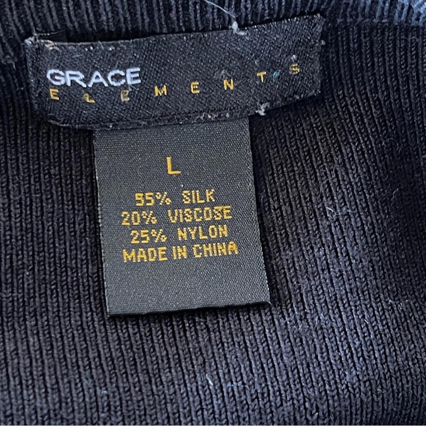 A very elegant Grace Elements Black Knit Sweater in size L